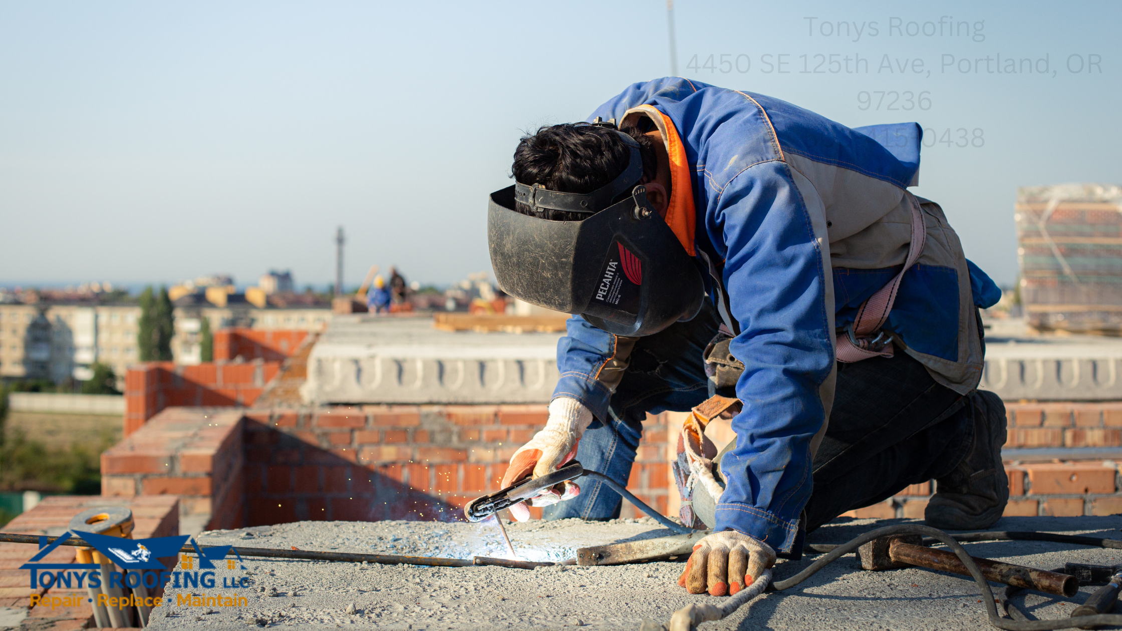 Worker in protective gear cutting metal on a rooftop with a power tool. Cityscape and construction materials visible in the background.